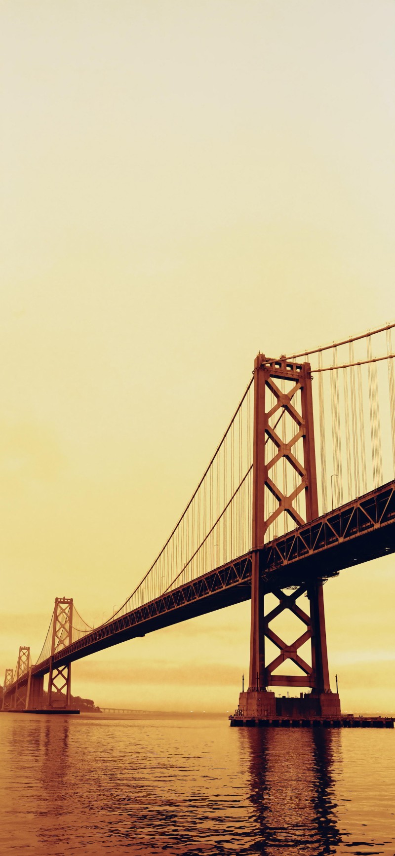 Golden Hour View of Iconic Suspension Bridge over Water 4K Oni Wallpaper