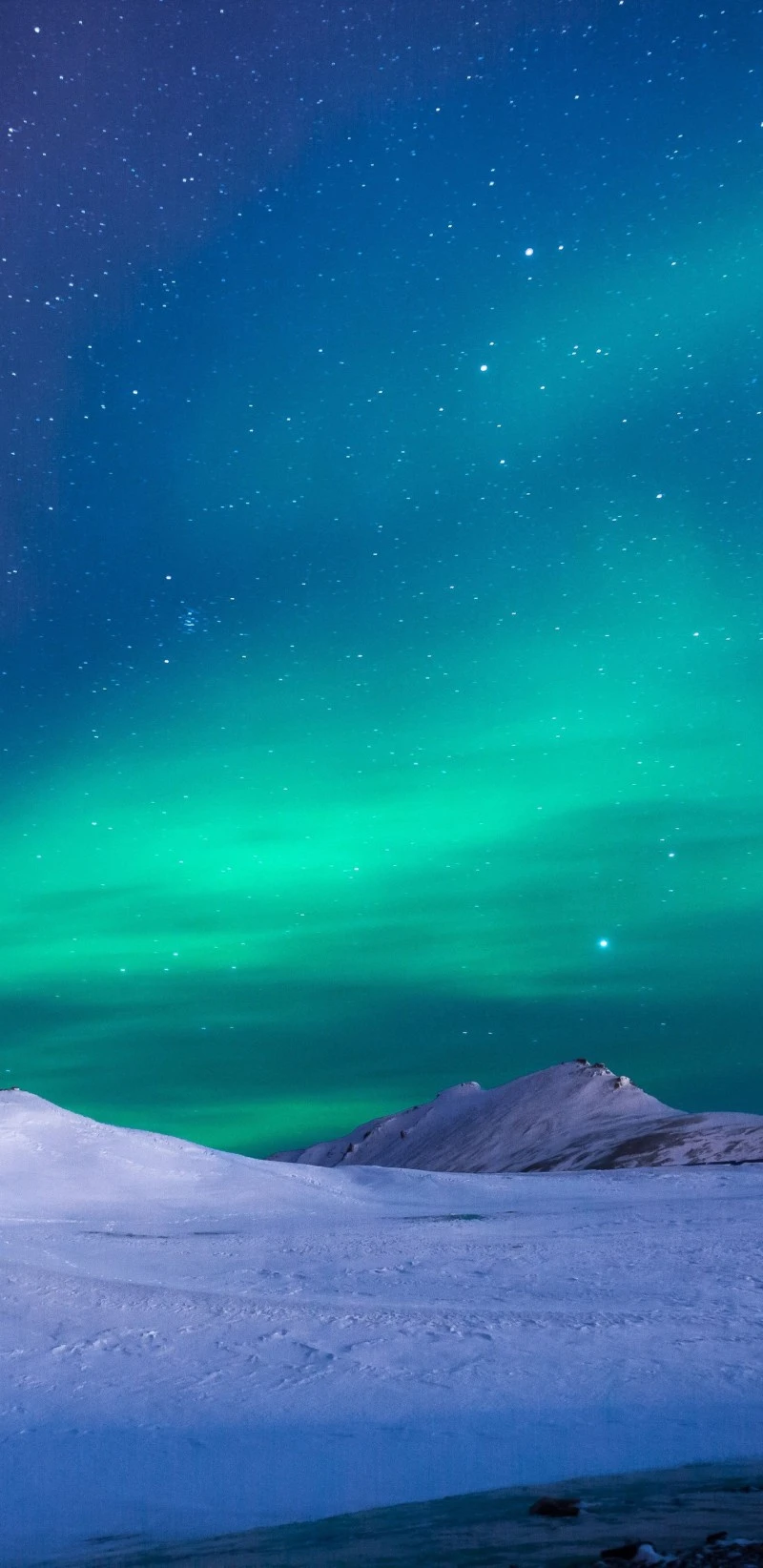 Aurora Borealis over Snowy Landscape 4K Mobile Wallpaper