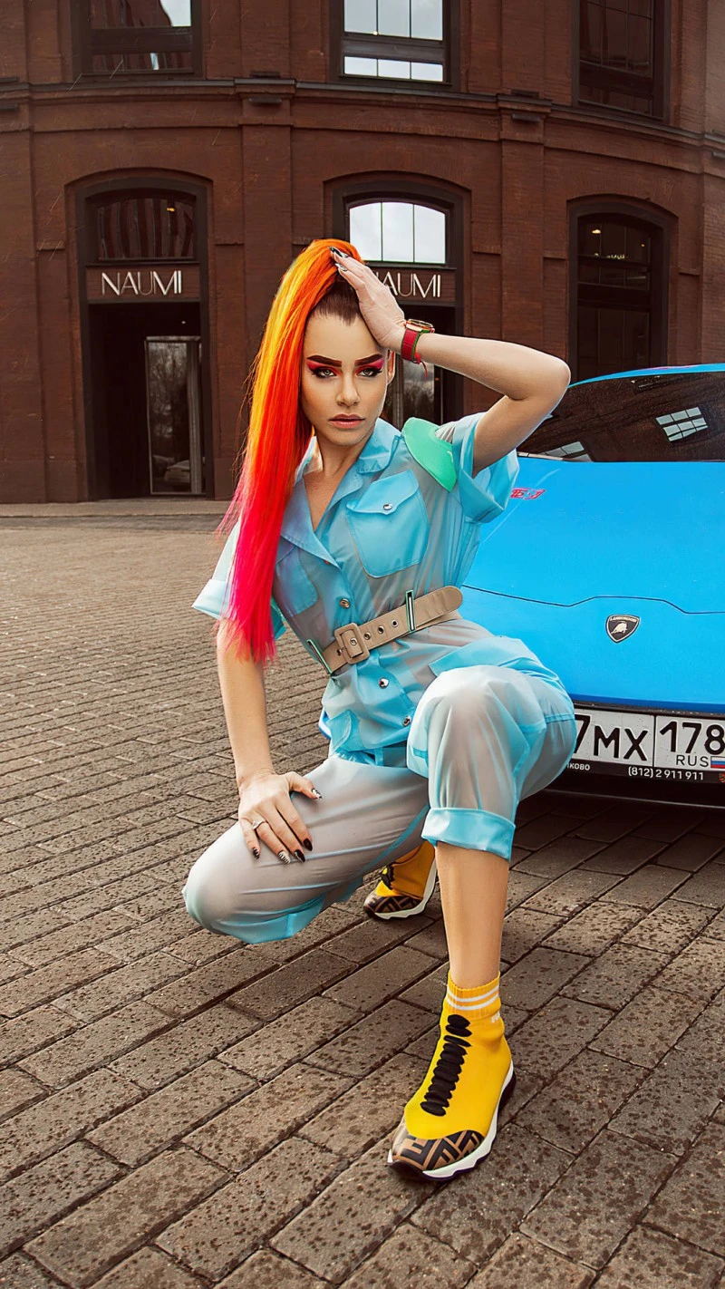 Stylish Woman with Blue Lamborghini 4K Mobile Wallpaper