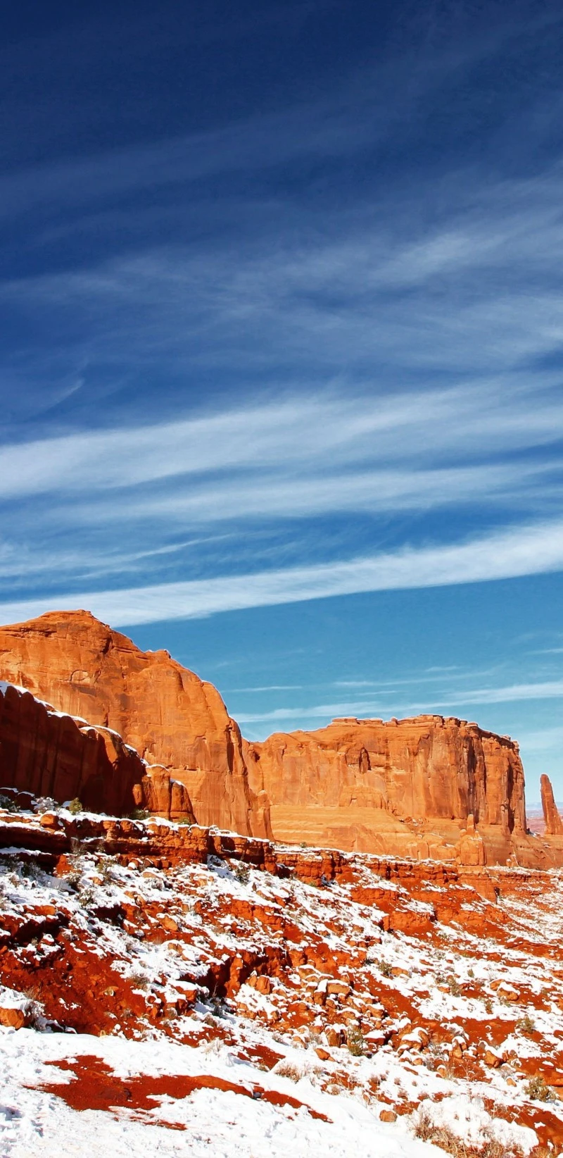 Snowy Canyon Under Blue Sky 4K Mobile Wallpaper