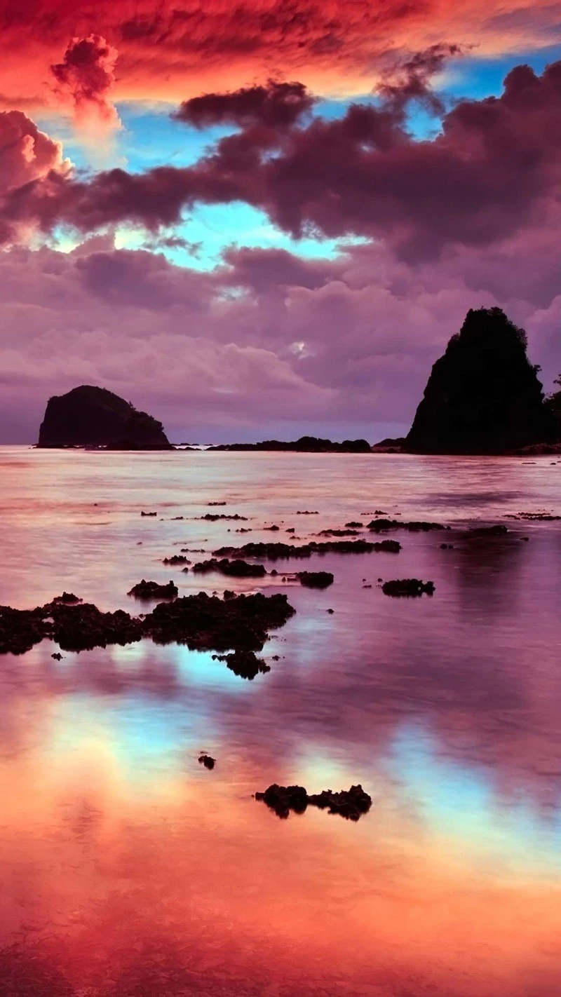 Vibrant Sunset over Volcanic Rocks 4K Mobile Wallpaper