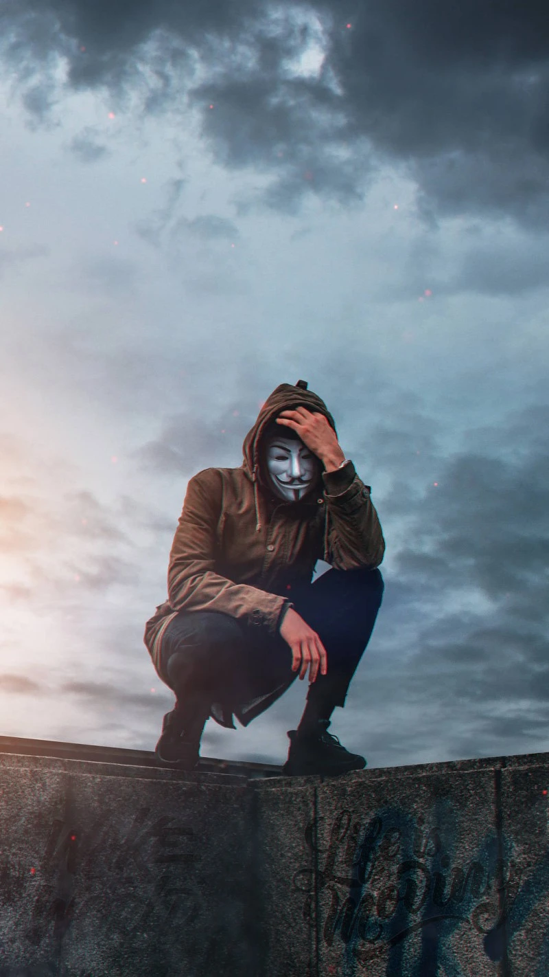 Anonymous Under a Cloudy Sky 4K Mobile Wallpaper