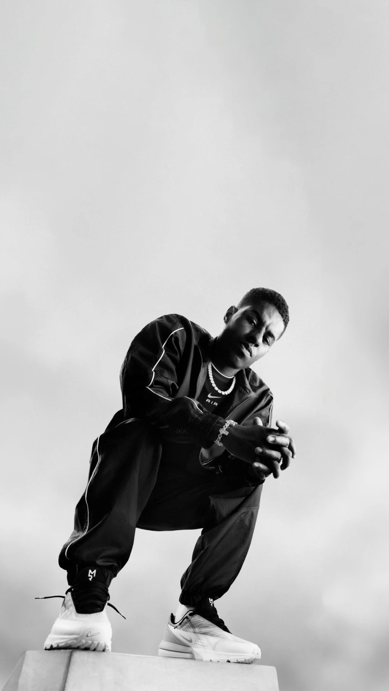 Young Basketball Player in Black and White 4K Mobile Wallpaper