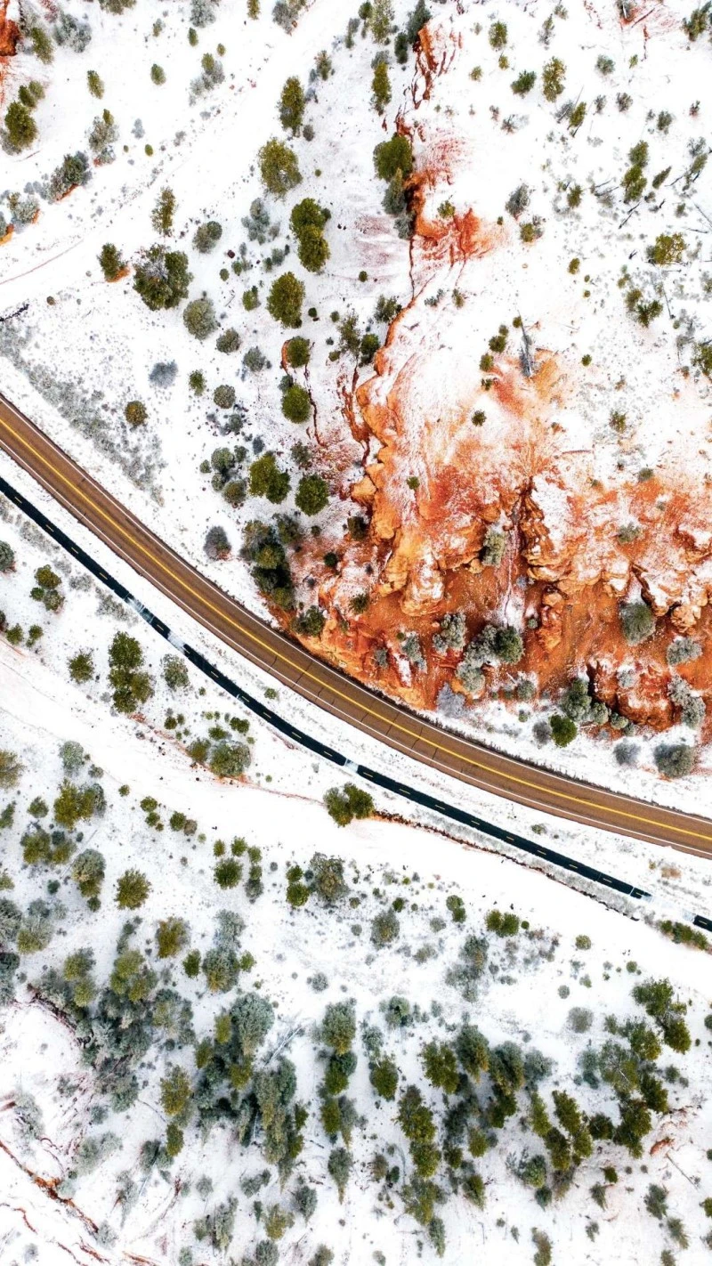 Snowy Road Through Red Rock Canyon 4K Mobile Wallpaper