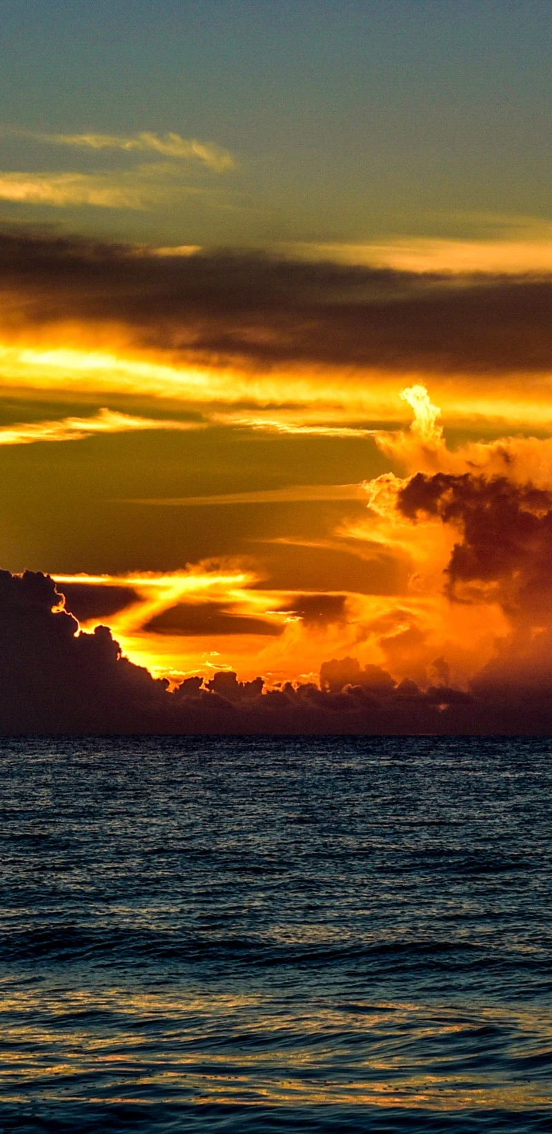 Fiery Sunset Over the Ocean 4K Mobile Wallpaper