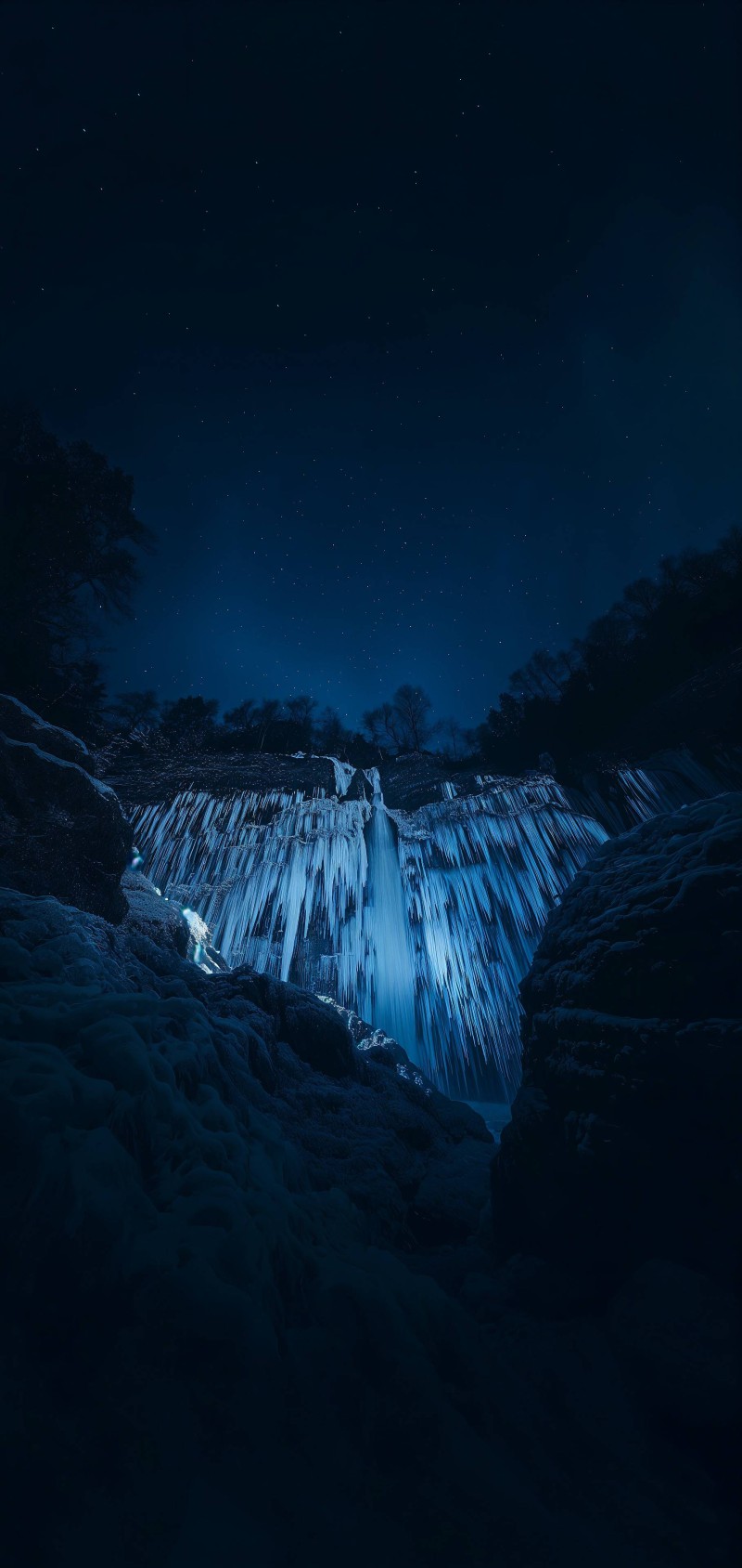 Enchanting Frozen Waterfall Under Starry Night Sky 4K Ice Wallpaper