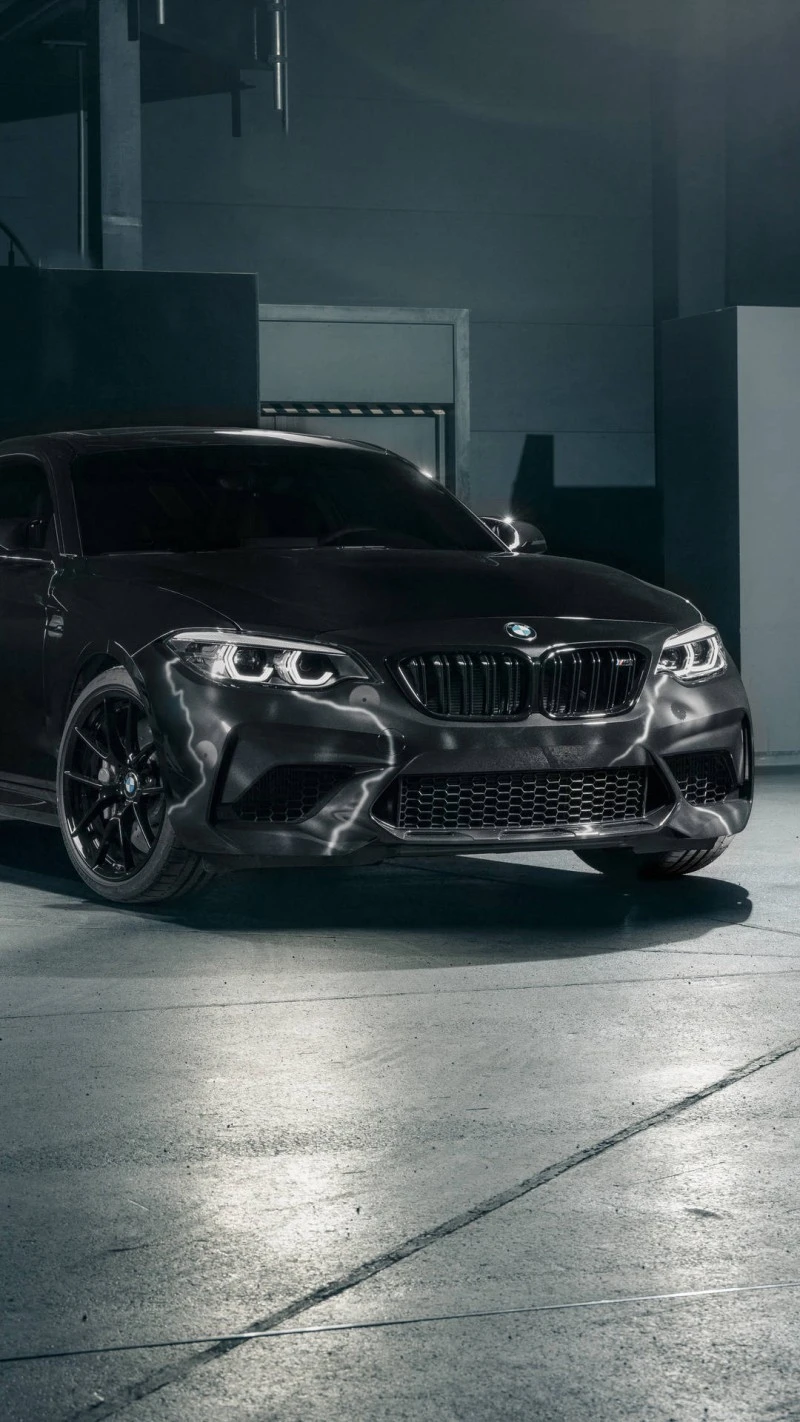 Black BMW M2 in Industrial Setting 4K Mobile Wallpaper