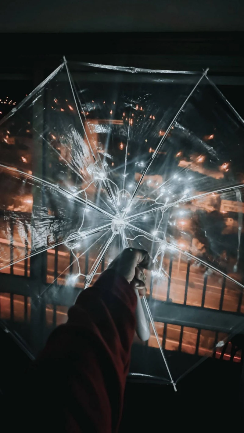 City Lights Under a Lighted Umbrella 4K Mobile Wallpaper