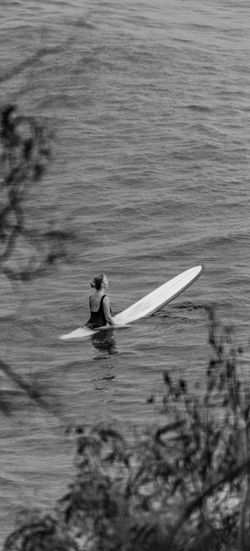 Serene Surfer on a Calm Sea 4K Mobile Wallpaper