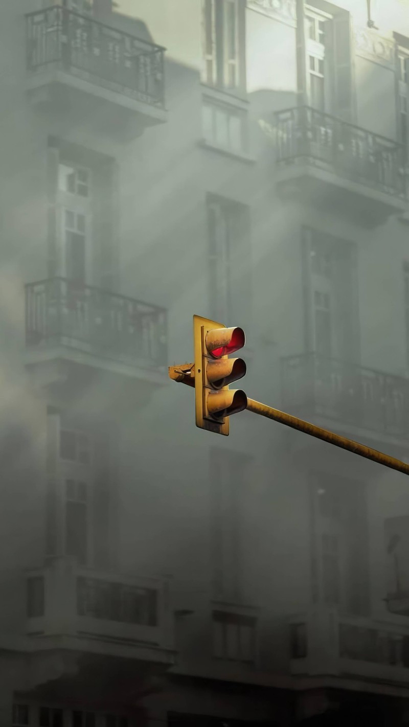Red Traffic Light in Foggy City Street 4K Building Wallpaper