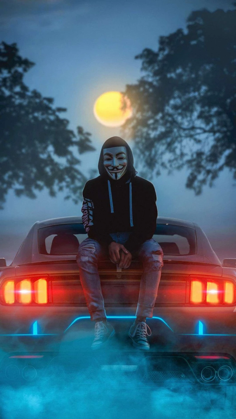 Anonymous Hacker on a Car 4K Mobile Wallpaper