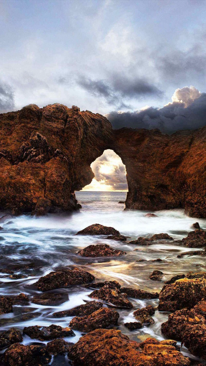 Sunset Through the Rock Arch 4K Mobile Wallpaper