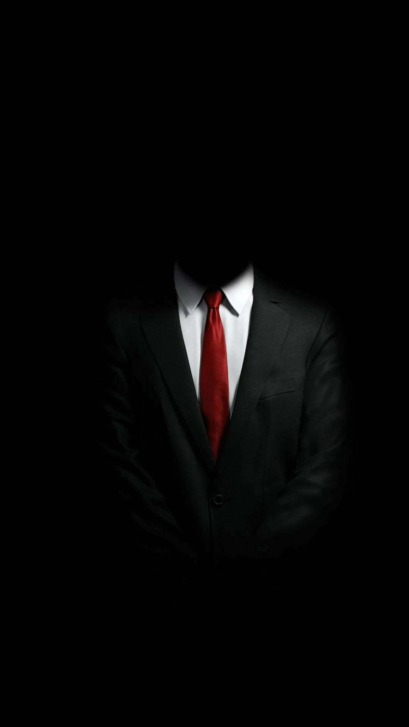 Mysterious Figure in a Suit 4K Mobile Wallpaper