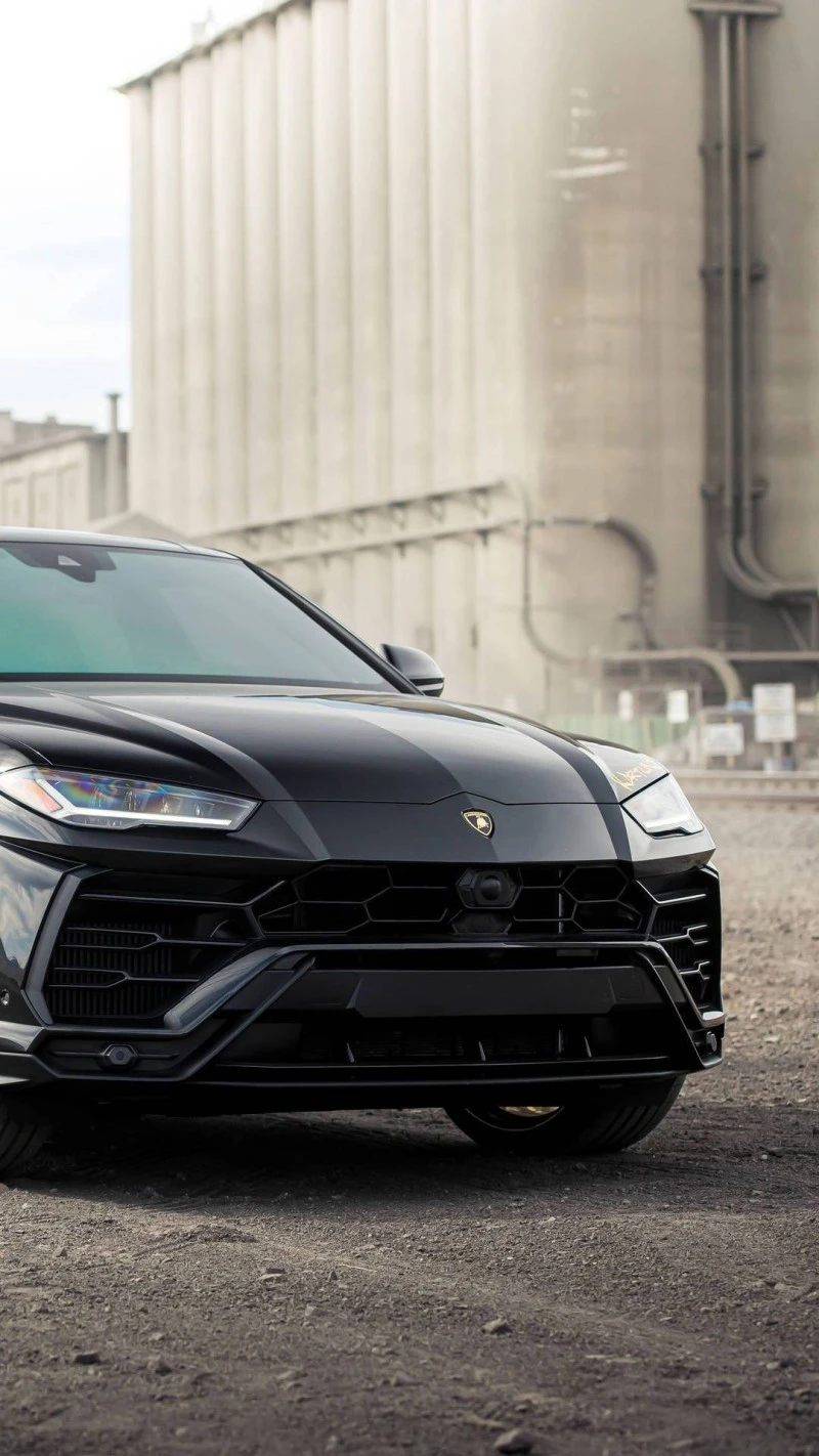 Black Lamborghini Urus Industrial Setting 4K Mobile Wallpaper