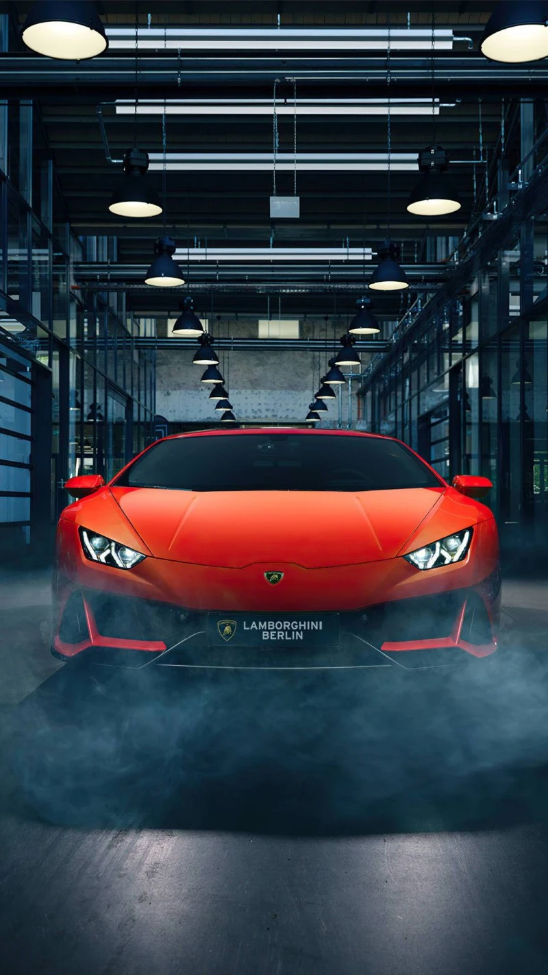 Red Lamborghini Huracán in Industrial Setting 4K Mobile Wallpaper