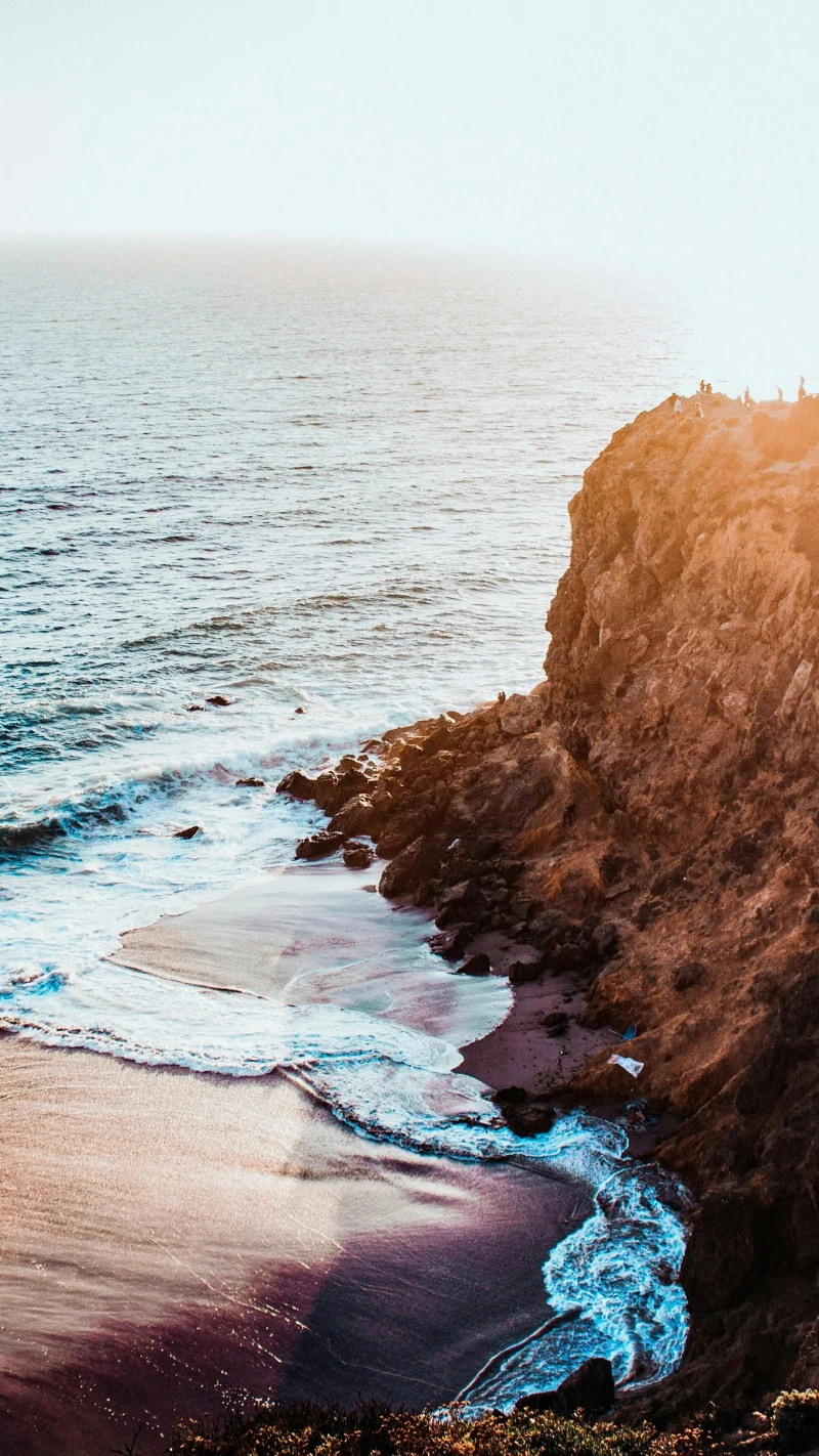Sunset on a Rocky Coastline 4K Mobile Wallpaper