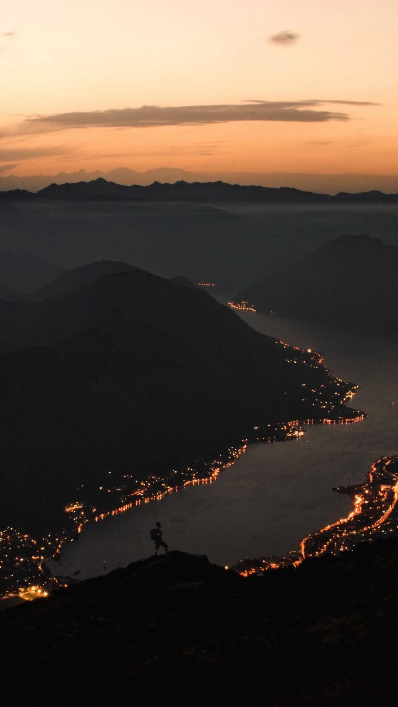 Night View of Coastal City from Mountaintop 4K Mobile Wallpaper
