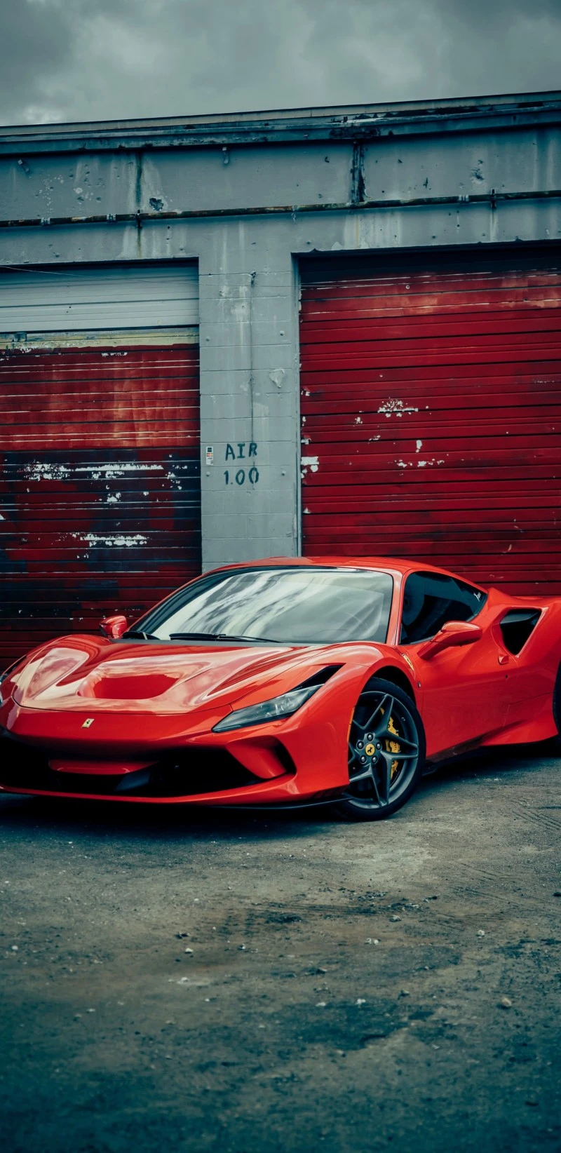 Red Ferrari Parked by Garage 4K Mobile Wallpaper