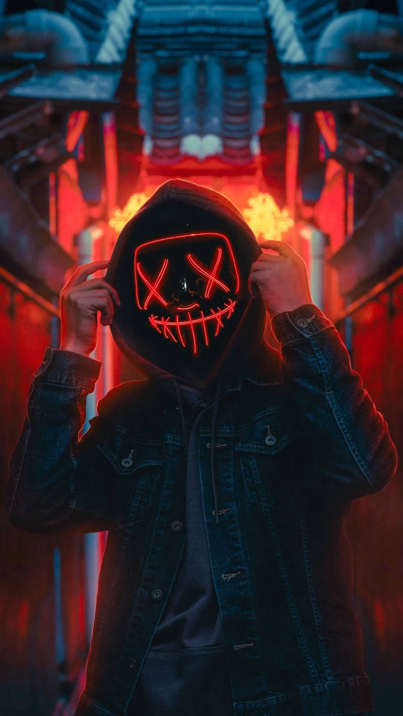 Red Neon Mask in Industrial Setting 4K Mobile Wallpaper