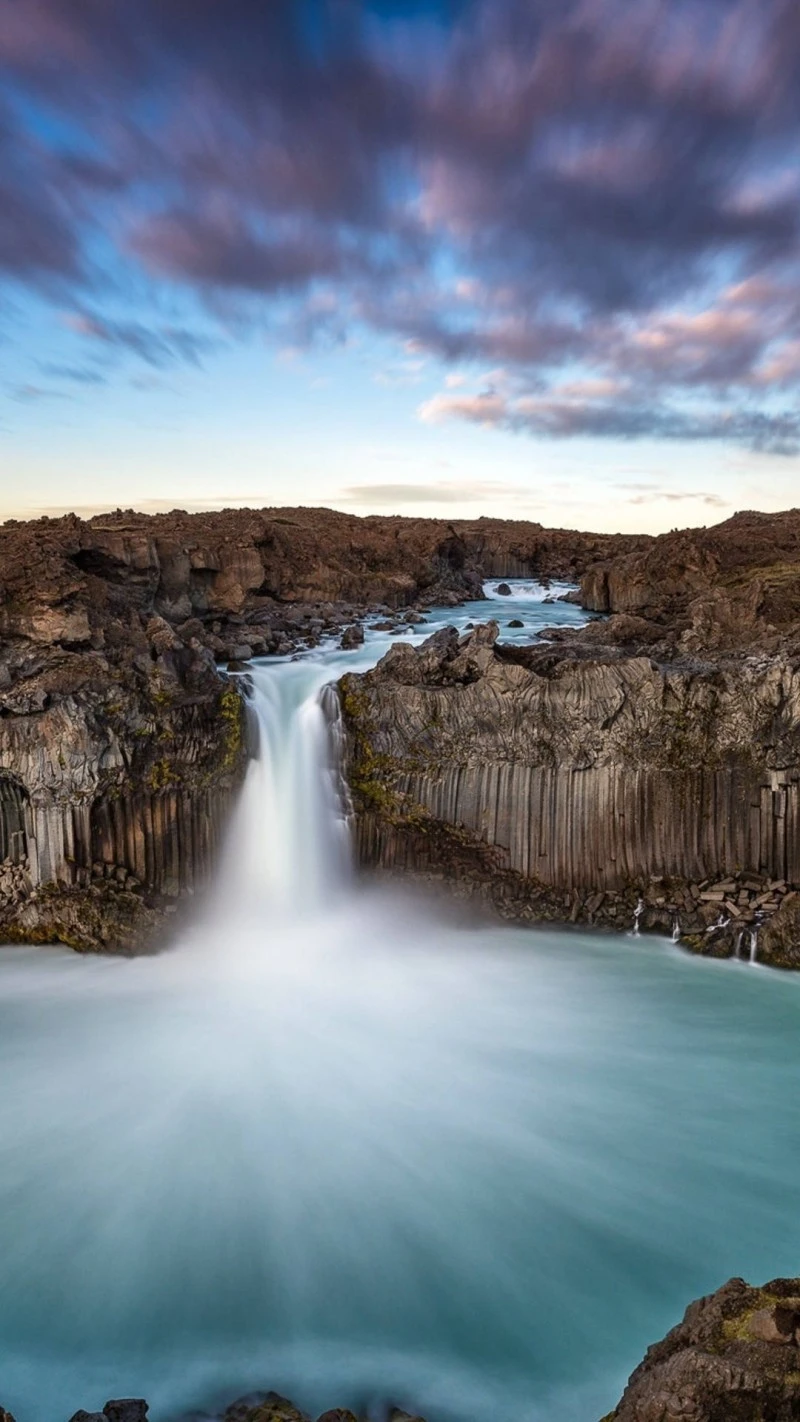 Majestic Icelandic Waterfall at Sunset 4K Mobile Wallpaper