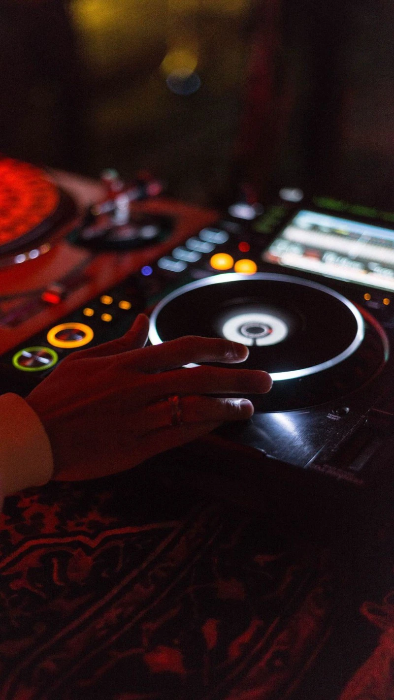 DJ Mixing on Turntables 4K Mobile Wallpaper