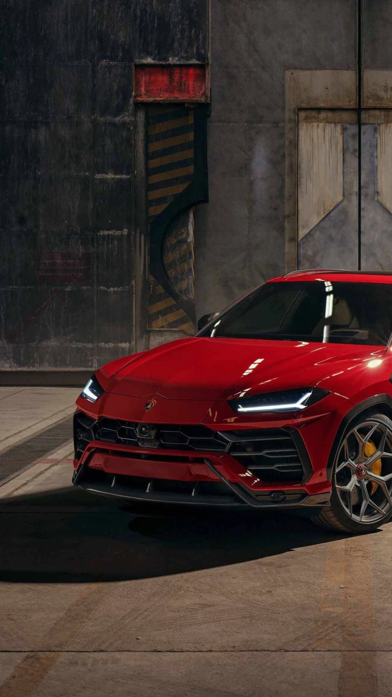 Red Lamborghini Urus in Industrial Setting 4K Mobile Wallpaper