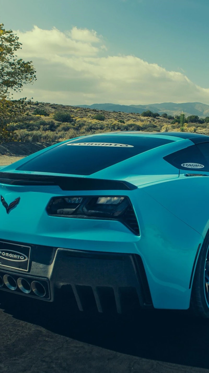 Blue Corvette Stingray in Desert Landscape 4K Mobile Wallpaper