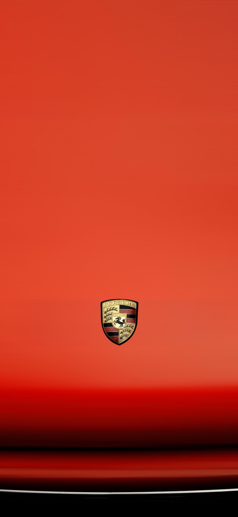 Vibrant Red Porsche Emblem on a Sleek Car Hood Wallpaper 4K X Wallpaper
