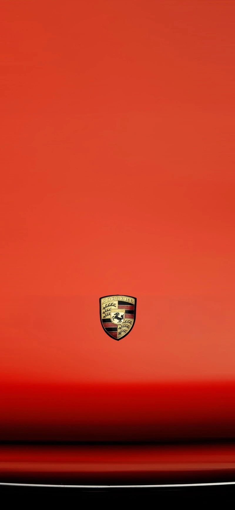 Vibrant Red Porsche Emblem on a Sleek Car Hood Wallpaper 4K Mobile Wallpaper
