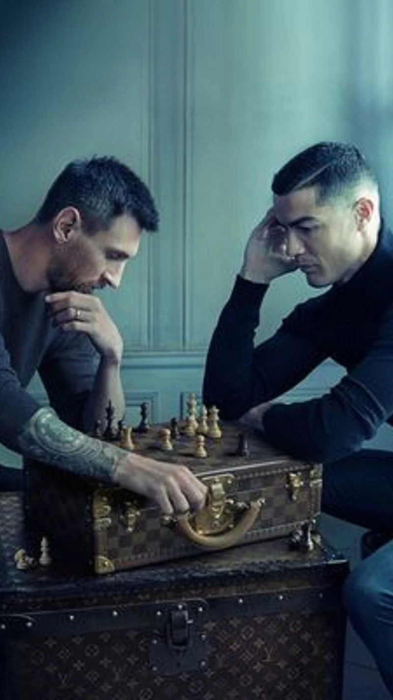 Messi vs. Ronaldo: A Game of Strategy 4K Mobile Wallpaper