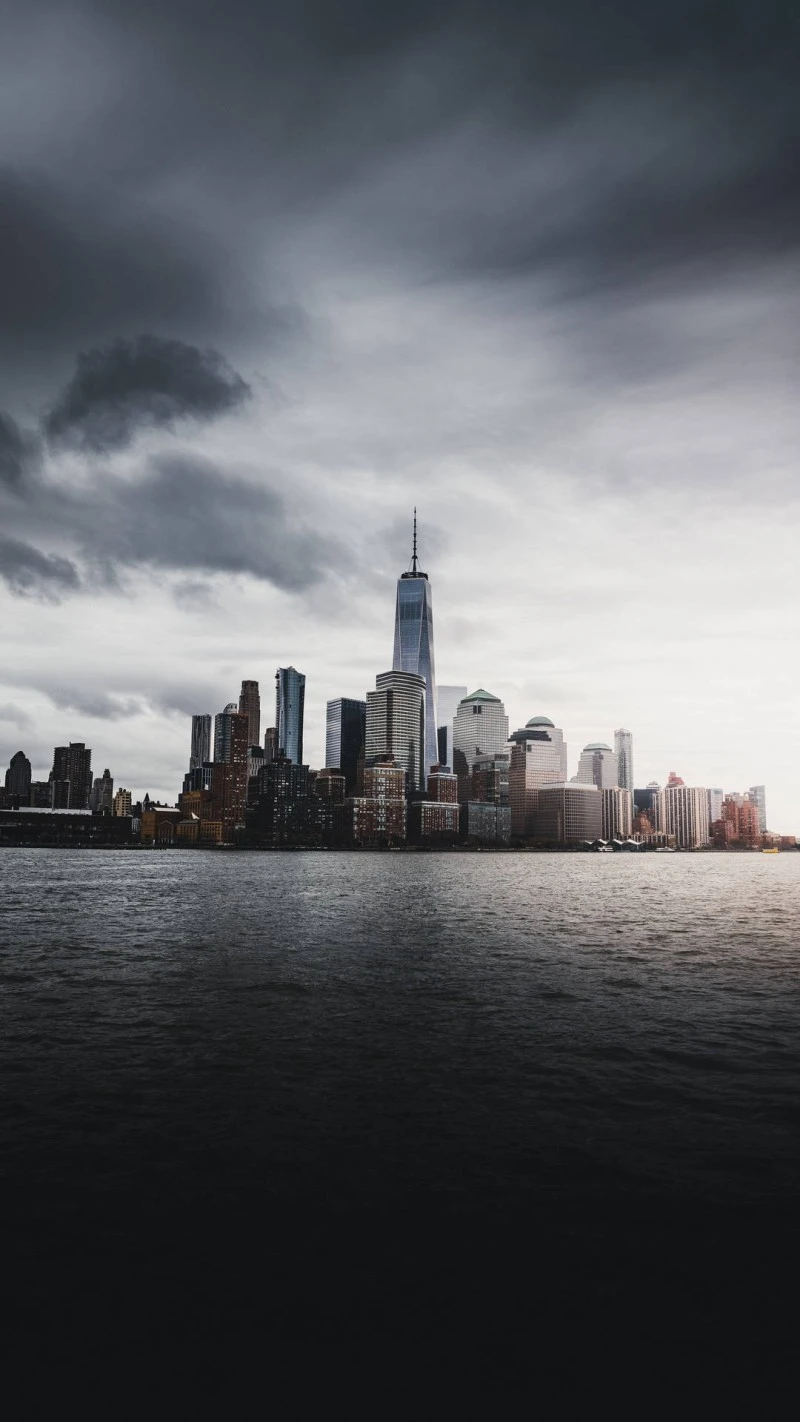 Manhattan Skyline Under Stormy Clouds 4K Mobile Wallpaper
