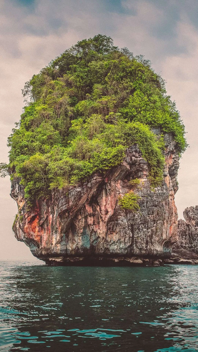 Lush Island Rock Formation 4K Mobile Wallpaper