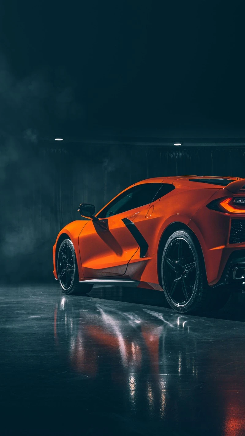 Orange Corvette in Dramatic Lighting 4K Mobile Wallpaper