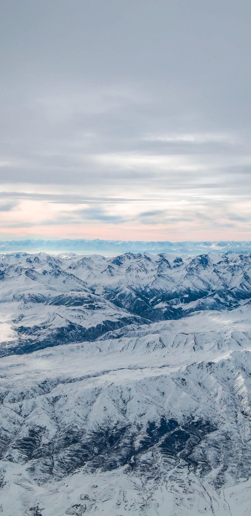 Aerial View of Snowy Mountains 4K Mobile Wallpaper