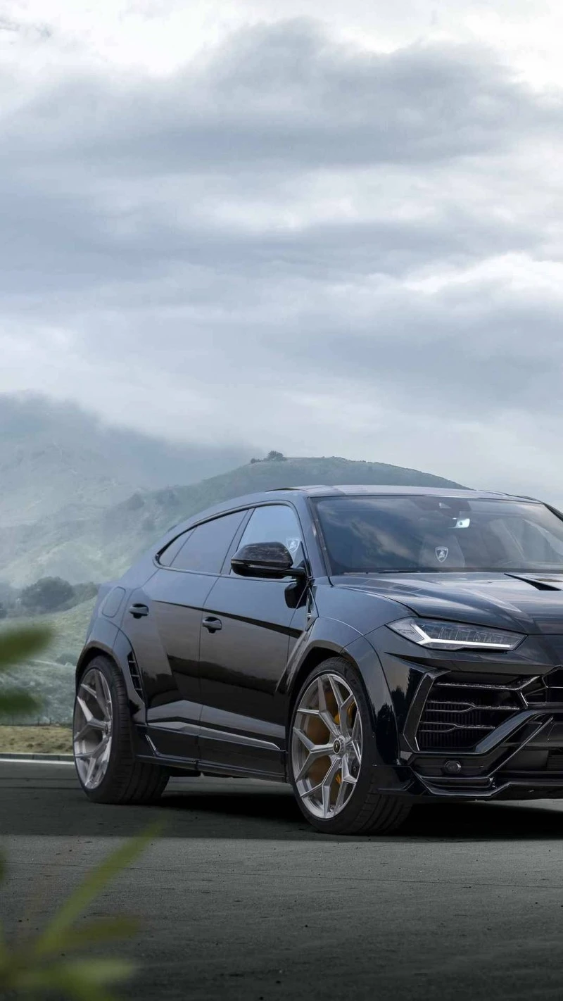 Black Lamborghini Urus on Mountain Road 4K Mobile Wallpaper