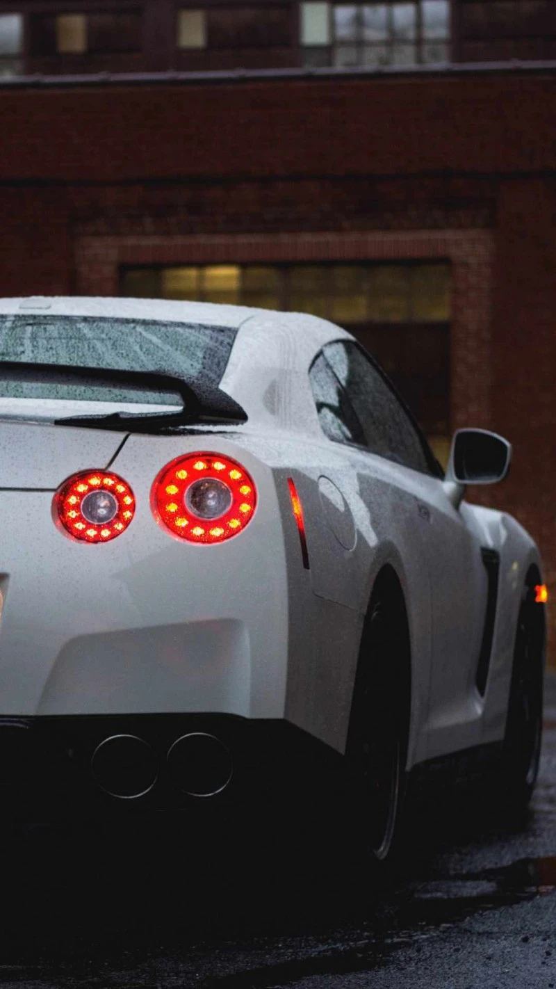 White Nissan GT-R in the Rain 4K Mobile Wallpaper