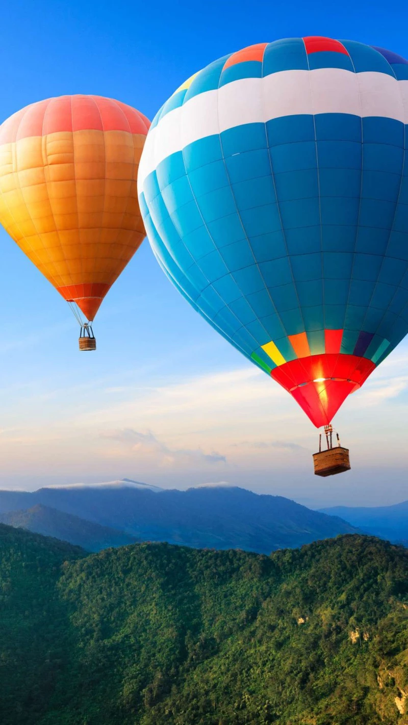 Hot Air Balloons over Majestic Mountains 4K Mobile Wallpaper