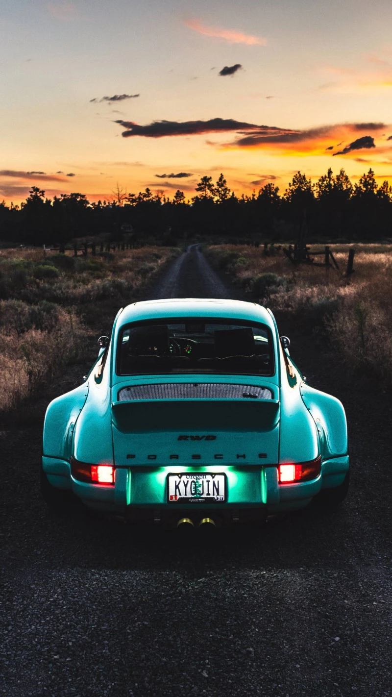 Porsche at Sunset on Country Road 4K Mobile Wallpaper