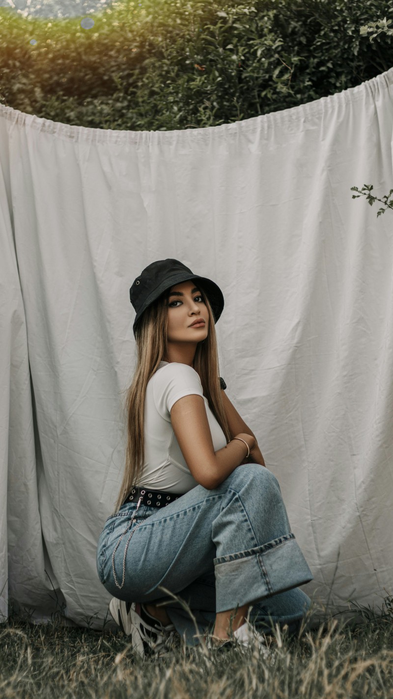 Girl in Black Hat and White Shirt 4K Mobile Wallpaper