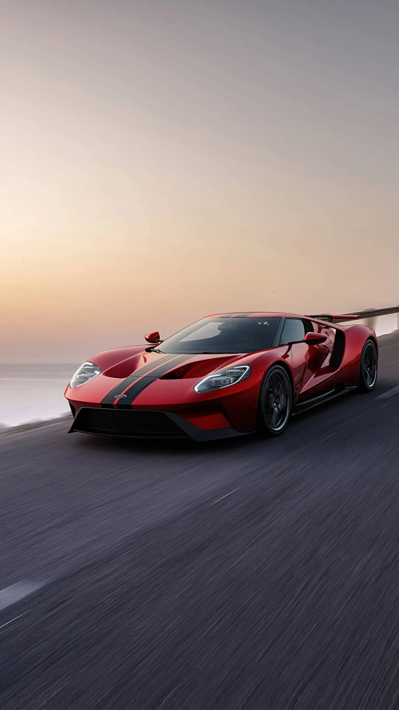 Red Ford GT on the road at sunset 4K Mobile Wallpaper