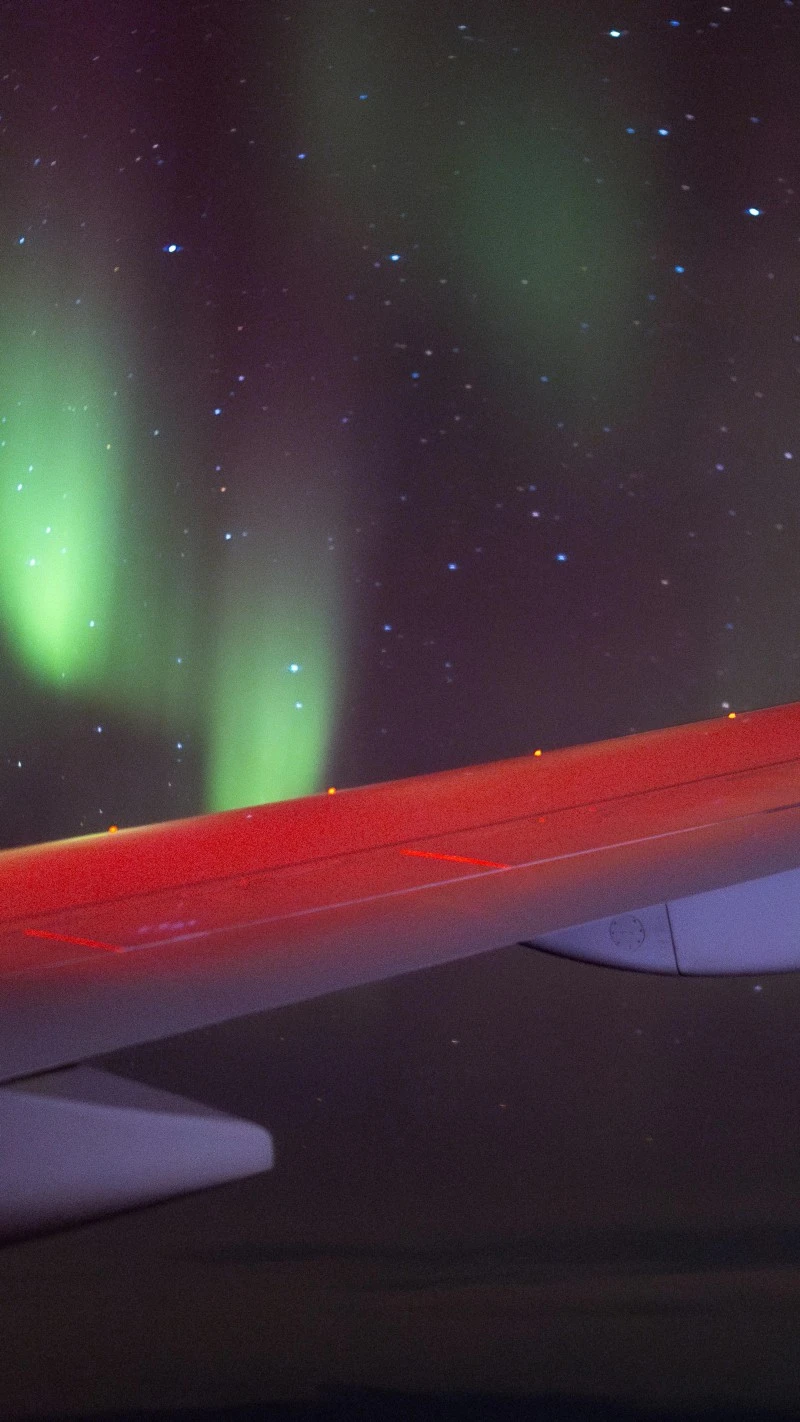 Aurora borealis from a plane 4K Mobile Wallpaper
