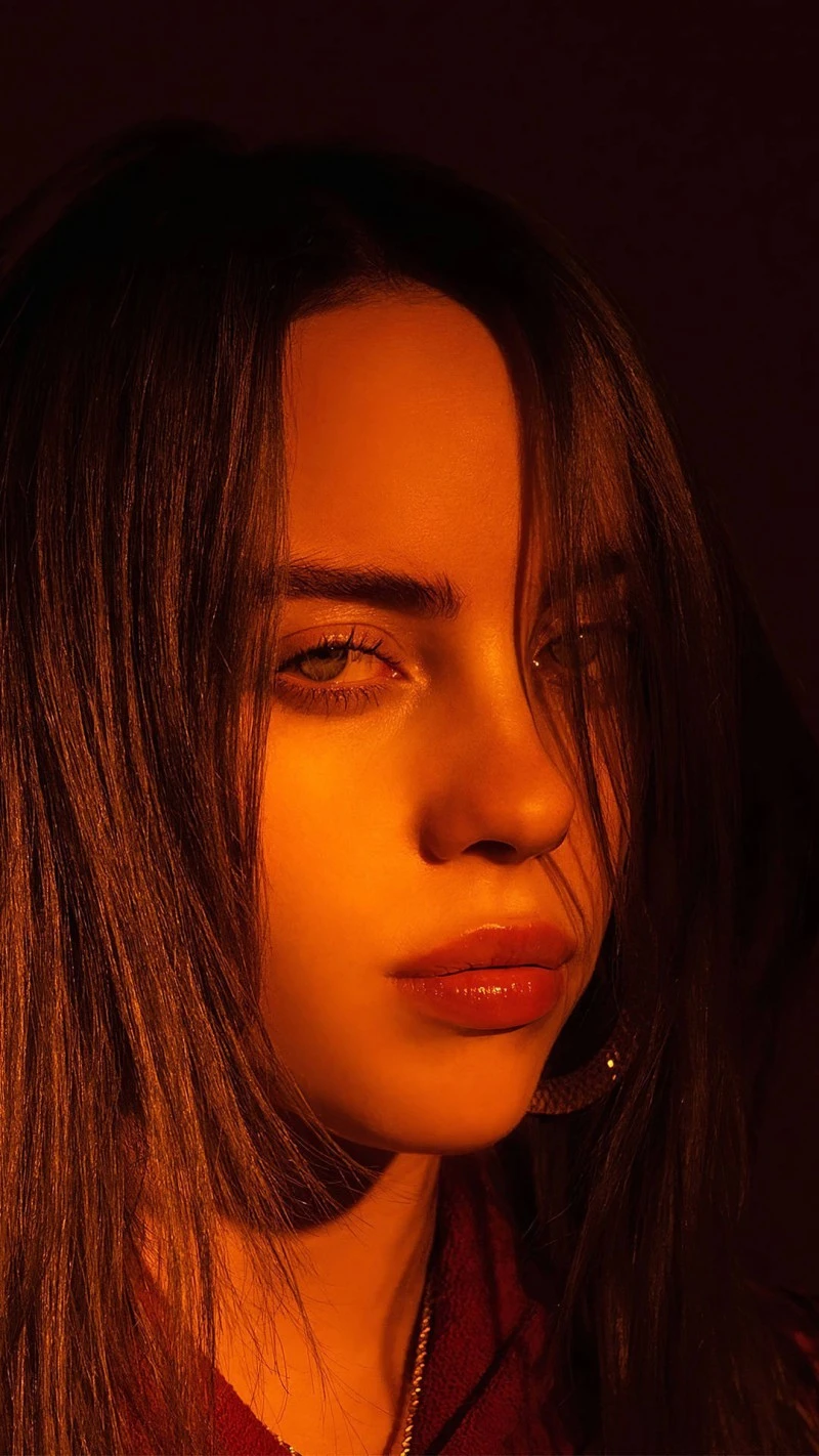 Billie Eilish in Golden Light 4K Mobile Wallpaper