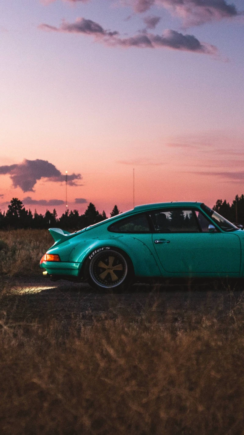 Sunset Cruise: Teal Porsche 911 4K Mobile Wallpaper