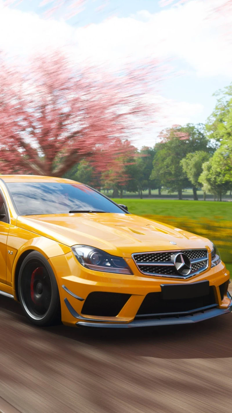 Yellow Mercedes-Benz C63 AMG Black Series in Motion 4K Mobile Wallpaper