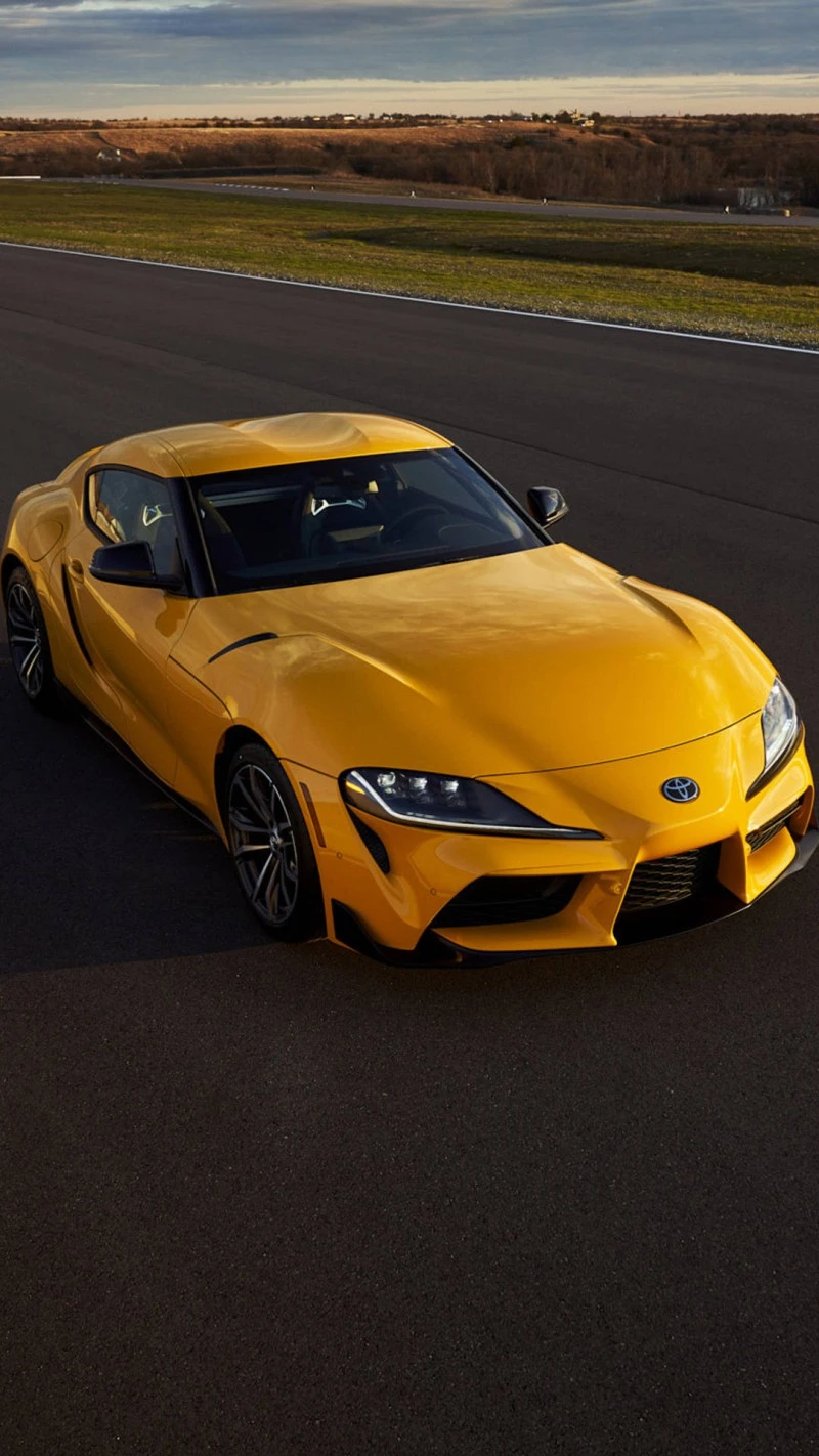 Yellow Toyota GR Supra on the Racetrack 4K Mobile Wallpaper