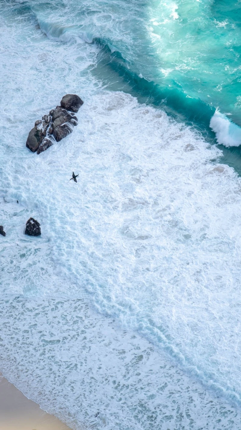 Aerial View of Ocean Waves and Rocks 4K Mobile Wallpaper
