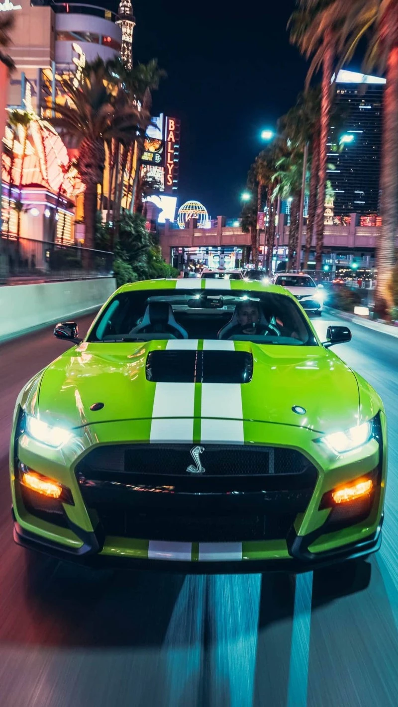 Green Mustang Shelby GT500 in Las Vegas at Night 4K Mobile Wallpaper