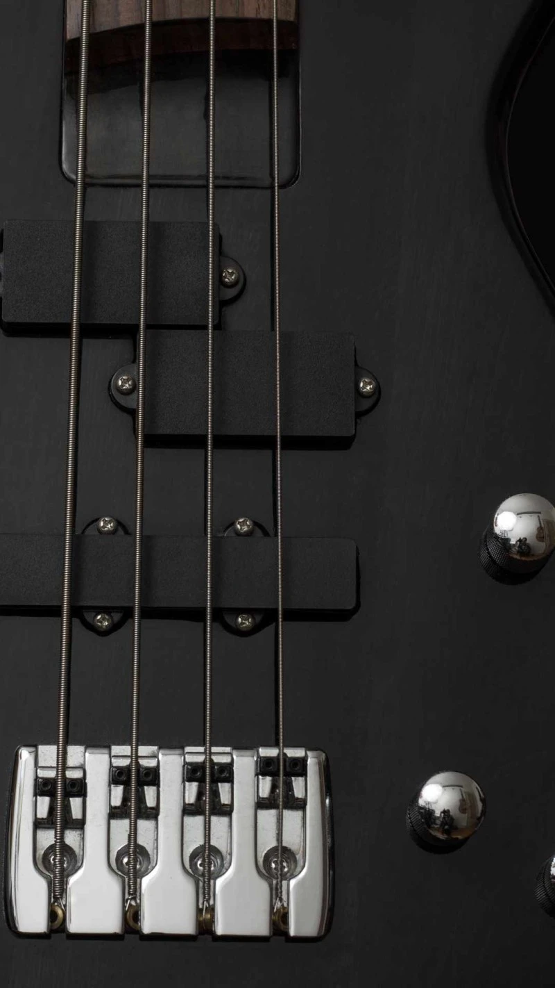 Close-up of a Black Bass Guitar 4K Mobile Wallpaper