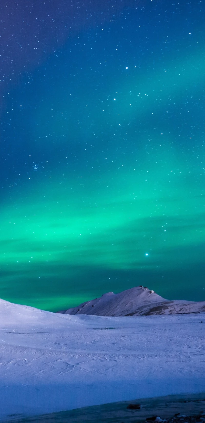 Aurora Borealis over Snowy Hills 4K Mobile Wallpaper