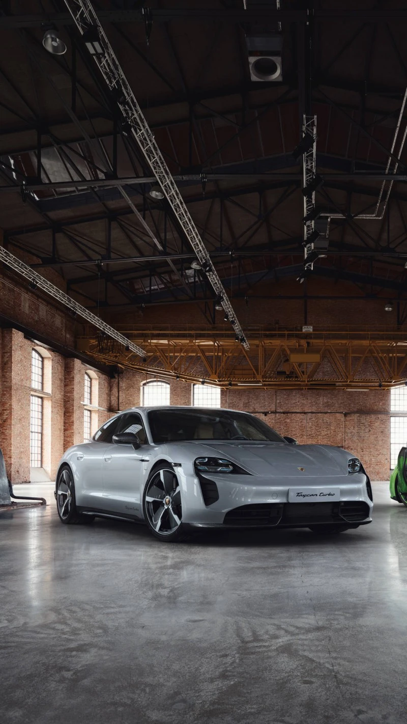 Porsche Taycan Turbo in Industrial Setting 4K Mobile Wallpaper